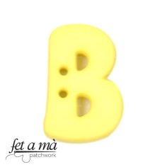Botón letra B amarillo